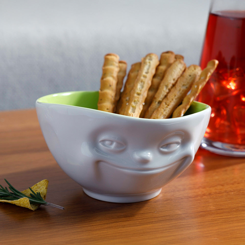 Premium porcelain bowl in white with pistachio color inside from the porcelain product family by FIFTYEIGHT Products. Offers 16 oz capacity perfect for serving cereal, soup, snacks and much more. Dishwasher and microwave safe bowl featuring a sculpted ‘grinning’ facial expression. Shipped in exclusively designed gift box.