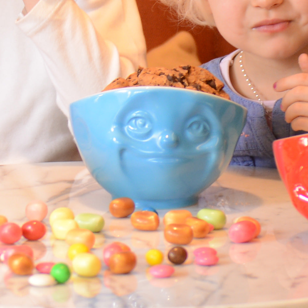 Premium porcelain bowl in blue from the porcelain product family of fun dishware by FIFTYEIGHT Products. Offers 16 oz capacity perfect for serving cereal, soup, snacks and much more. Dishwasher and microwave safe bowl featuring a sculpted ‘sulking’ facial expression. Shipped in exclusively designed gift box.