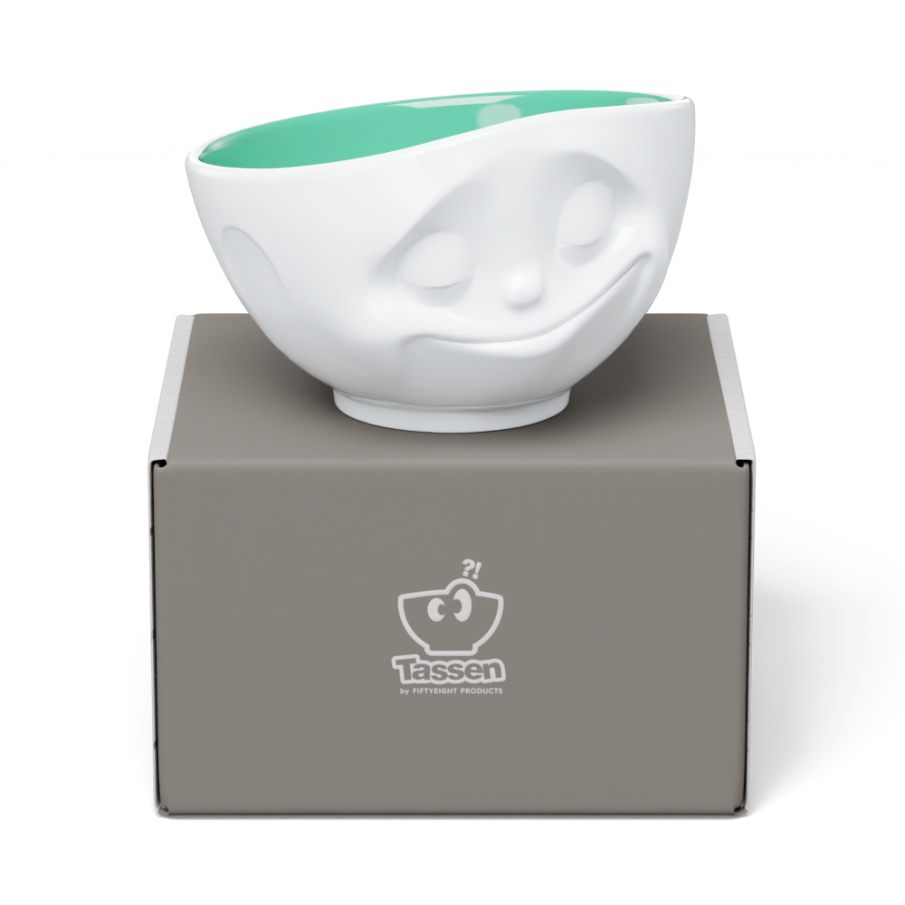 Premium porcelain bowl in white with jade color on the inside from the porcelain product family of fun dishware by FIFTYEIGHT Products. Offers 16 oz capacity perfect for serving cereal, soup, snacks and much more. Dishwasher and microwave safe bowl featuring a sculpted ‘happy’ facial expression. Shipped in exclusively designed gift box.