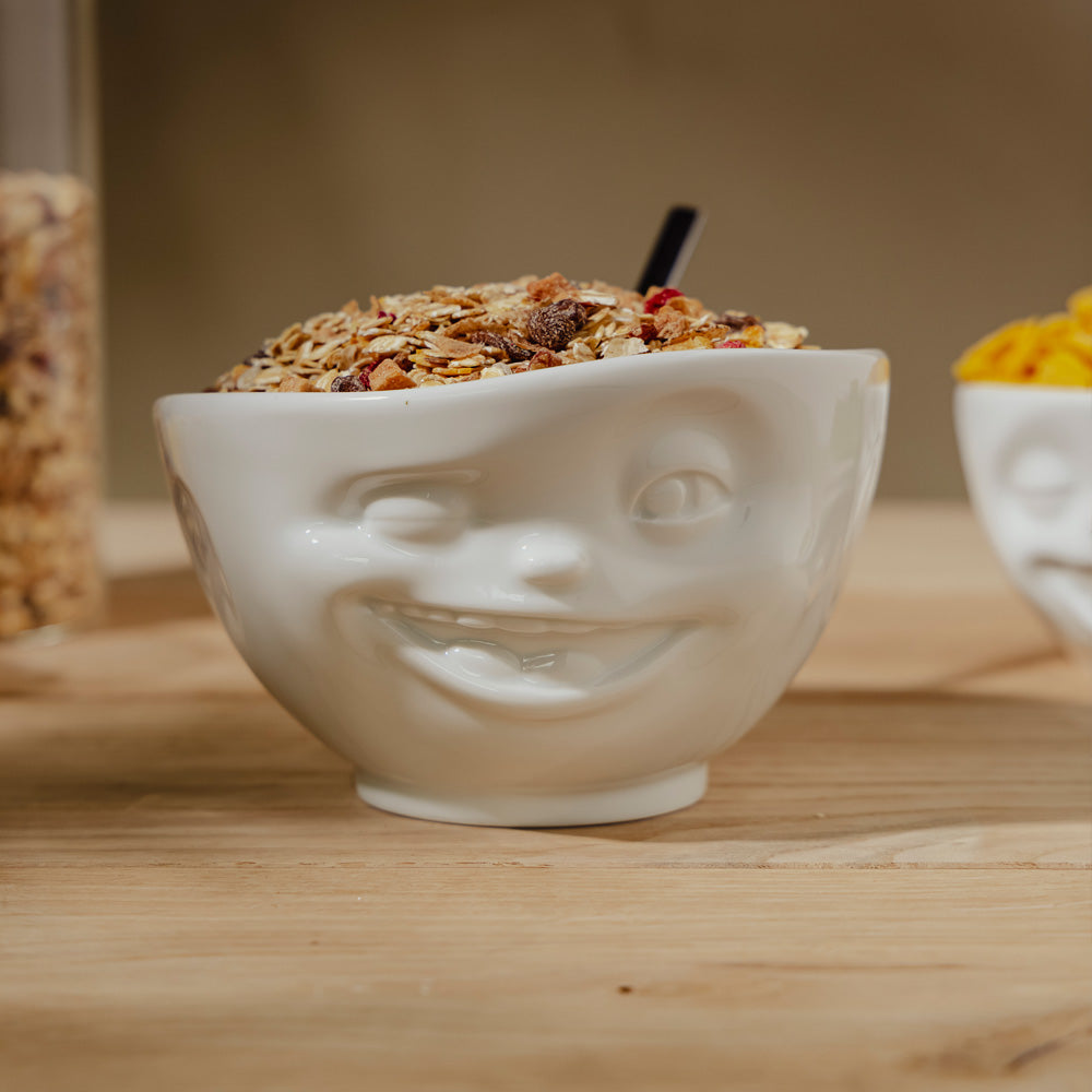 Premium porcelain bowl in white from the porcelain product family of fun dishware by FIFTYEIGHT Products. Offers 16 oz capacity perfect for serving cereal, soup, snacks and much more. Dishwasher and microwave safe bowl featuring a sculpted ‘winking’ facial expression. Shipped in exclusively designed gift box.
