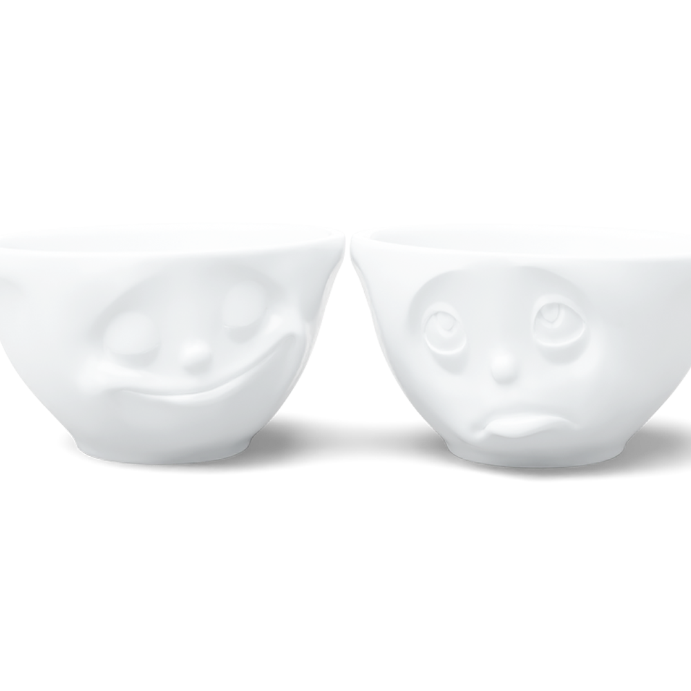 Set of two 6.5 oz. bowls in white from the porcelain product family of fun dishware by FIFTYEIGHT Products. Perfect for serving snacks, nuts, chips, dips, sauces, and a few scoops of ice cream. Dishwasher and microwave safe bowls featuring sculpted ‘happy’ and 'Oh please' faces. Shipped in exclusively designed gift box.