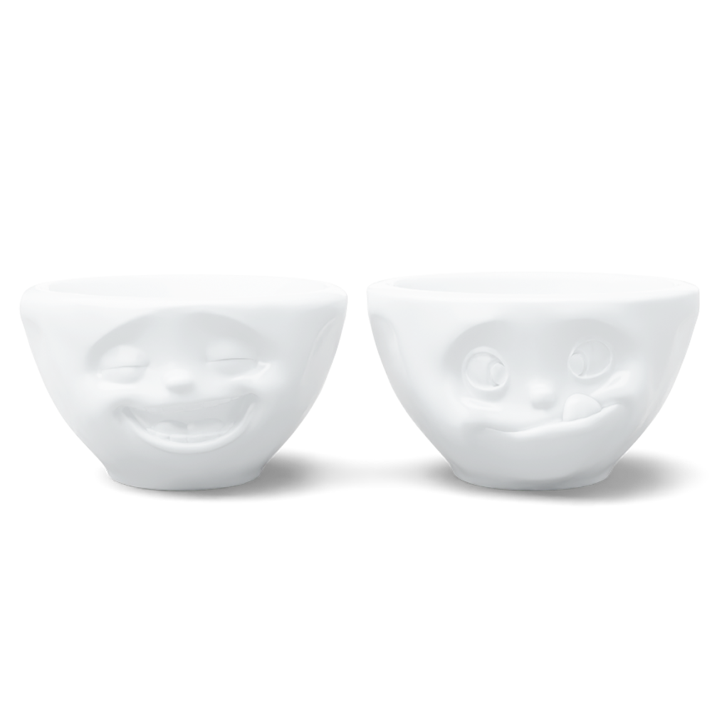 Set of two 3.3 oz. bowls in white from the porcelain product family of fun dishware by FIFTYEIGHT Products. Perfect for serving dips, sauces, nuts, sugar, spices, espresso, jam, honey, and more. Dishwasher and microwave safe bowls featuring 'laughing' and 'tasty' faces. Shipped in exclusively designed gift box.