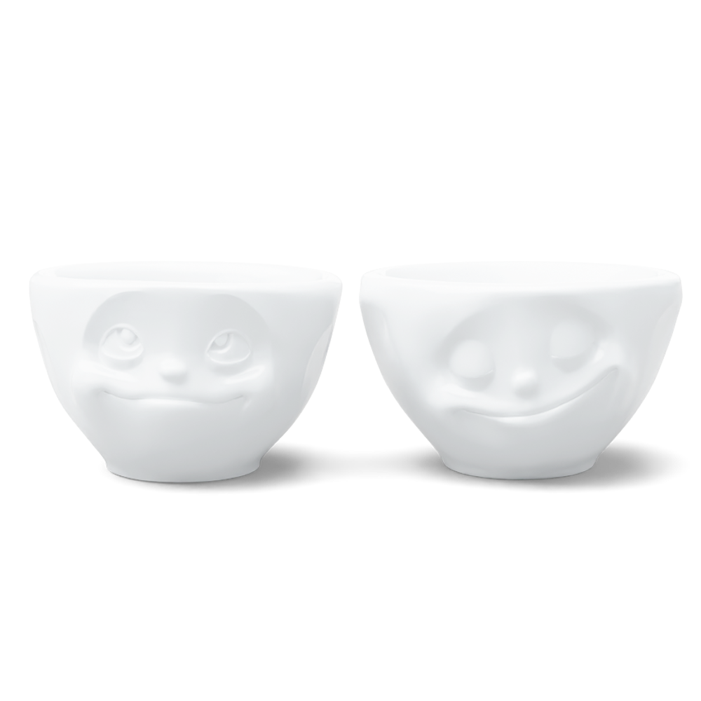 Set of two 3.3 oz. bowls in white from the porcelain product family of fun dishware by FIFTYEIGHT Products. Perfect for serving dips, sauces, nuts, sugar, spices, espresso, jam, honey, and more. Dishwasher and microwave safe bowls featuring 'happy' and 'Dreamy' faces. Shipped in exclusively designed gift box.
