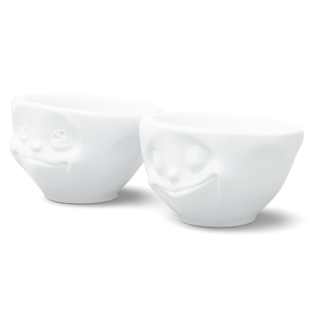 Set of two 3.3 oz. bowls in white from the porcelain product family of fun dishware by FIFTYEIGHT Products. Perfect for serving dips, sauces, nuts, sugar, spices, espresso, jam, honey, and more. Dishwasher and microwave safe bowls featuring 'happy' and 'Dreamy' faces. Shipped in exclusively designed gift box.