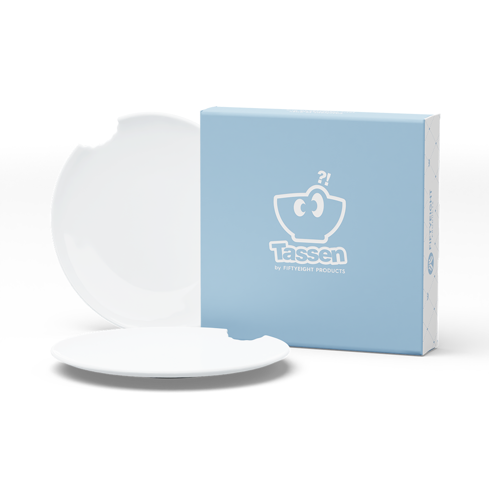 Set of two premium tiny porcelain plates in white with a 'bite mark' cutout at the edge. Dishwasher and microwave safe plate with a 5.9 inch diameter. From the TASSEN product family of fun dishware by FIFTYEIGHT Products. Made in Germany according to environmental standards.