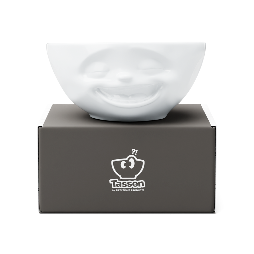 Premium porcelain bowl in white from the porcelain product family of fun dishware by FIFTYEIGHT Products. Offers 11 oz capacity perfect for serving ice cream to tapas, nuts and hearty dips. Dishwasher and microwave safe bowl featuring a sculpted ‘laughing’ facial expression. Shipped in exclusively designed gift box.