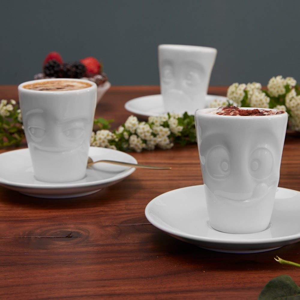Premium porcelain espresso cup with saucer in white from the porcelain product family of fun dishware by FIFTYEIGHT Products. Offers 2.7 oz capacity and comes with a matching saucer. Dishwasher and microwave safe cup with an 'impish' facial expression. Shipped in exclusively designed gift box.