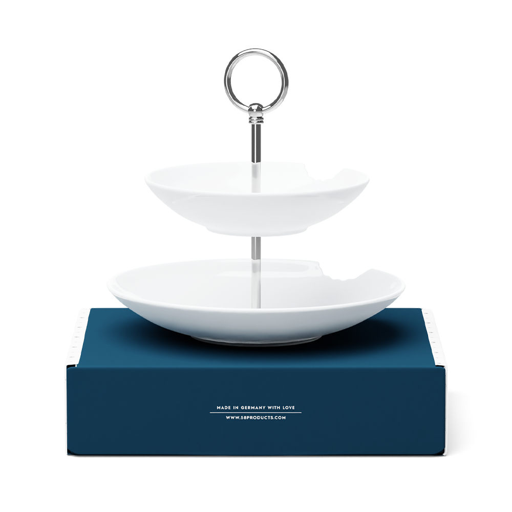 The two-Tiered Serving Platter brings tons of fun to the table. Features two deep plates with fun bite marks mounted on a pole. Perfect for building a grand seafood tower! From the porcelain product family of fun dishware by FIFTYEIGHT Products. Made in Germany according to environmental standards.