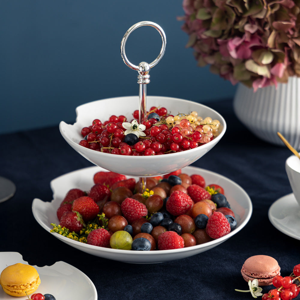 The two-Tiered Serving Platter brings tons of fun to the table. Features two deep plates with fun bite marks mounted on a pole. Perfect for building a grand seafood tower! From the porcelain product family of fun dishware by FIFTYEIGHT Products. Made in Germany according to environmental standards.
