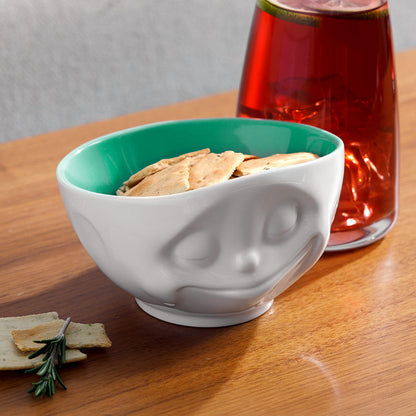 Premium porcelain bowl in white with jade color on the inside from the porcelain product family of fun dishware by FIFTYEIGHT Products. Offers 16 oz capacity perfect for serving cereal, soup, snacks and much more. Dishwasher and microwave safe bowl featuring a sculpted ‘happy’ facial expression. Shipped in exclusively designed gift box.