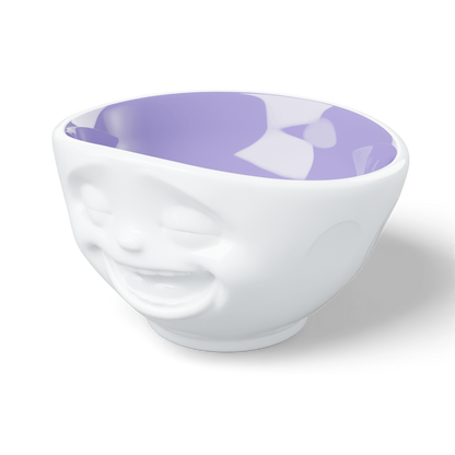 Premium porcelain bowl in white with lavender color inside from the porcelain product family by FIFTYEIGHT Products. Offers 16 oz capacity perfect for serving cereal, soup, snacks and much more. Dishwasher and microwave safe bowl featuring a sculpted ‘laughing’ facial expression. Shipped in exclusively designed gift box.