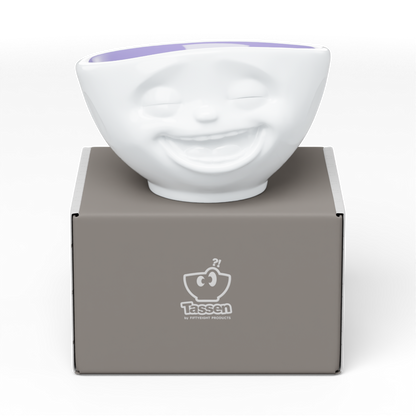 Premium porcelain bowl in white with lavender color inside from the porcelain product family by FIFTYEIGHT Products. Offers 16 oz capacity perfect for serving cereal, soup, snacks and much more. Dishwasher and microwave safe bowl featuring a sculpted ‘laughing’ facial expression. Shipped in exclusively designed gift box.