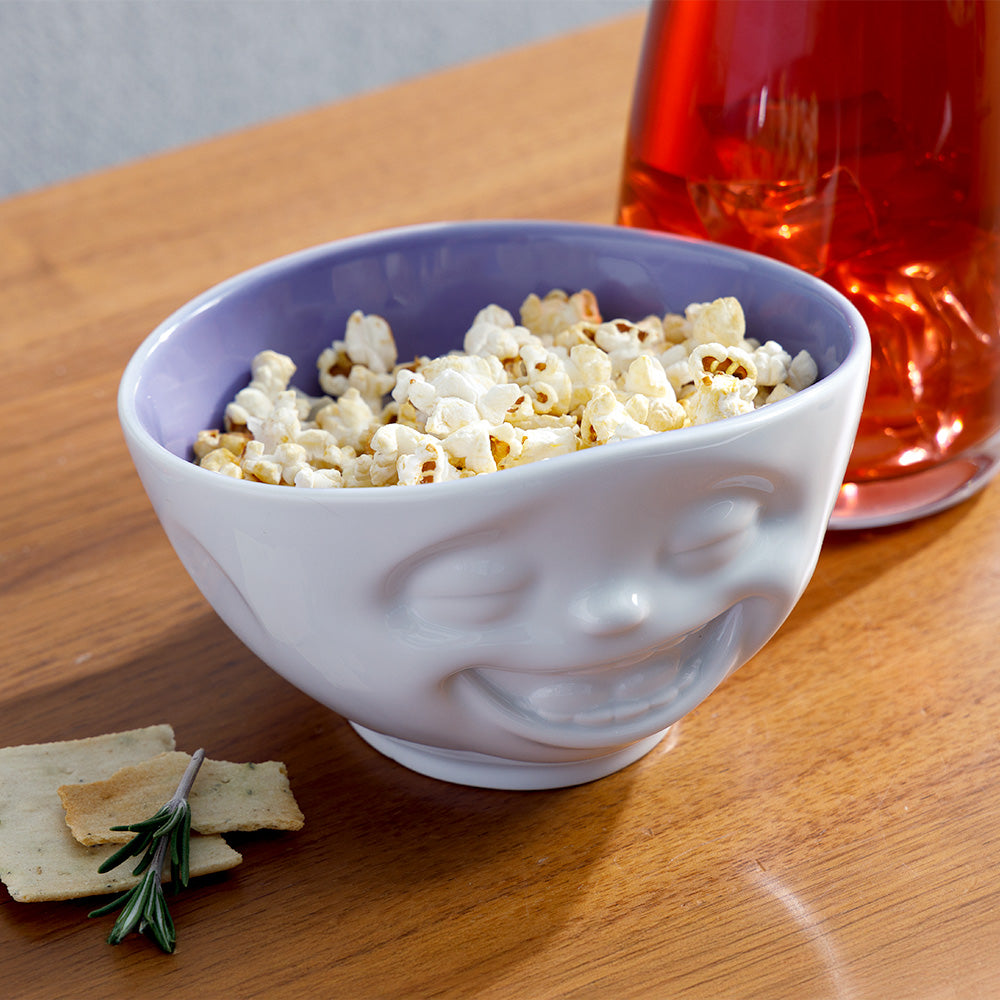 Premium porcelain bowl in white with lavender color inside from the porcelain product family by FIFTYEIGHT Products. Offers 16 oz capacity perfect for serving cereal, soup, snacks and much more. Dishwasher and microwave safe bowl featuring a sculpted ‘laughing’ facial expression. Shipped in exclusively designed gift box.