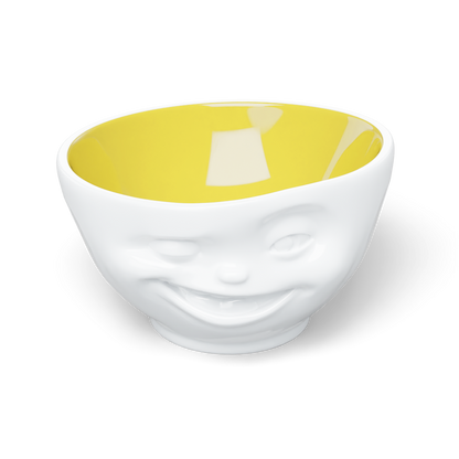 Premium porcelain bowl in white with Saffron Color Inside from the porcelain product family of fun dishware by FIFTYEIGHT Products. Offers 16 oz capacity perfect for serving cereal, soup, snacks and much more. Dishwasher and microwave safe bowl featuring a sculpted ‘winking’ facial expression. Shipped in exclusively designed gift box.