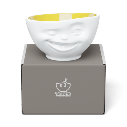 Premium porcelain bowl in white with Saffron Color Inside from the porcelain product family of fun dishware by FIFTYEIGHT Products. Offers 16 oz capacity perfect for serving cereal, soup, snacks and much more. Dishwasher and microwave safe bowl featuring a sculpted ‘winking’ facial expression. Shipped in exclusively designed gift box.