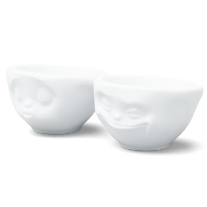 Set of two 3.3 oz. bowls in white from the porcelain product family of fun dishware by FIFTYEIGHT Products. Perfect for serving dips, sauces, nuts, sugar, spices, espresso, jam, honey, and more. Dishwasher and microwave safe bowls featuring 'grinning' and 'kissing' faces. Shipped in exclusively designed gift box.
