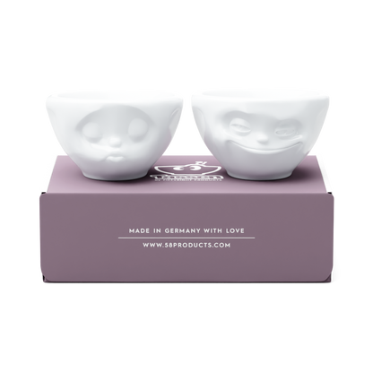 Set of two 3.3 oz. bowls in white from the porcelain product family of fun dishware by FIFTYEIGHT Products. Perfect for serving dips, sauces, nuts, sugar, spices, espresso, jam, honey, and more. Dishwasher and microwave safe bowls featuring 'grinning' and 'kissing' faces. Shipped in exclusively designed gift box.
