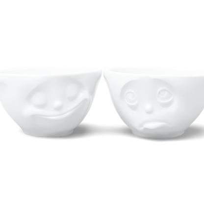 Set of two 6.5 oz. bowls in white from the porcelain product family of fun dishware by FIFTYEIGHT Products. Perfect for serving snacks, nuts, chips, dips, sauces, and a few scoops of ice cream. Dishwasher and microwave safe bowls featuring sculpted ‘happy’ and 'Oh please' faces. Shipped in exclusively designed gift box.