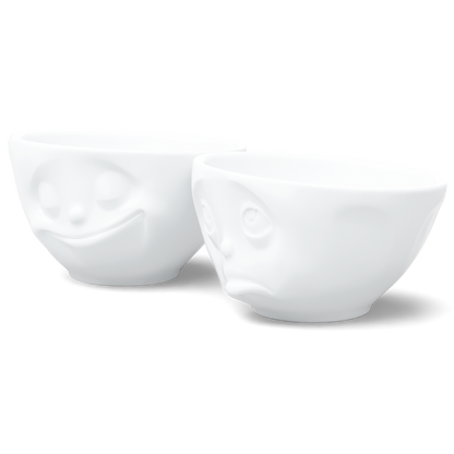 Set of two 6.5 oz. bowls in white from the porcelain product family of fun dishware by FIFTYEIGHT Products. Perfect for serving snacks, nuts, chips, dips, sauces, and a few scoops of ice cream. Dishwasher and microwave safe bowls featuring sculpted ‘happy’ and 'Oh please' faces. Shipped in exclusively designed gift box.
