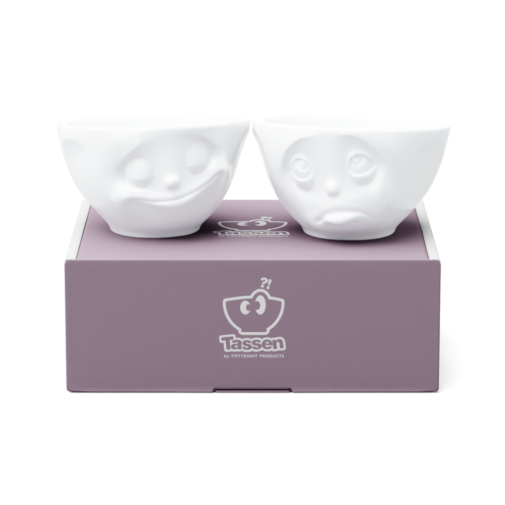 Set of two 6.5 oz. bowls in white from the porcelain product family of fun dishware by FIFTYEIGHT Products. Perfect for serving snacks, nuts, chips, dips, sauces, and a few scoops of ice cream. Dishwasher and microwave safe bowls featuring sculpted ‘happy’ and 'Oh please' faces. Shipped in exclusively designed gift box.