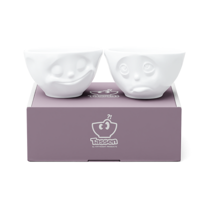 Set of two 6.5 oz. bowls in white from the porcelain product family of fun dishware by FIFTYEIGHT Products. Perfect for serving snacks, nuts, chips, dips, sauces, and a few scoops of ice cream. Dishwasher and microwave safe bowls featuring sculpted ‘happy’ and 'Oh please' faces. Shipped in exclusively designed gift box.