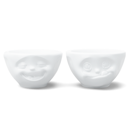 Set of two 3.3 oz. bowls in white from the porcelain product family of fun dishware by FIFTYEIGHT Products. Perfect for serving dips, sauces, nuts, sugar, spices, espresso, jam, honey, and more. Dishwasher and microwave safe bowls featuring 'laughing' and 'tasty' faces. Shipped in exclusively designed gift box.
