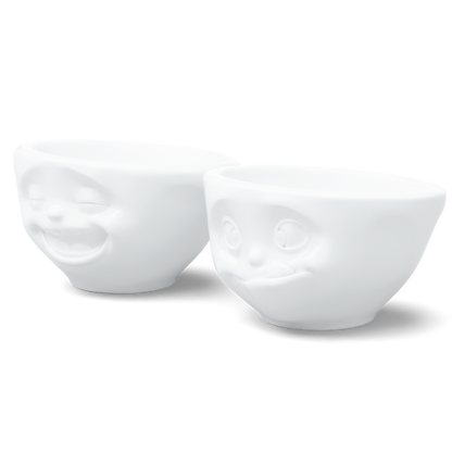 Set of two 3.3 oz. bowls in white from the porcelain product family of fun dishware by FIFTYEIGHT Products. Perfect for serving dips, sauces, nuts, sugar, spices, espresso, jam, honey, and more. Dishwasher and microwave safe bowls featuring 'laughing' and 'tasty' faces. Shipped in exclusively designed gift box.

