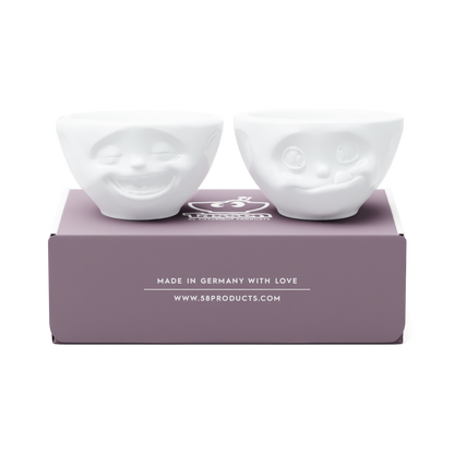 Set of two 3.3 oz. bowls in white from the porcelain product family of fun dishware by FIFTYEIGHT Products. Perfect for serving dips, sauces, nuts, sugar, spices, espresso, jam, honey, and more. Dishwasher and microwave safe bowls featuring 'laughing' and 'tasty' faces. Shipped in exclusively designed gift box.
