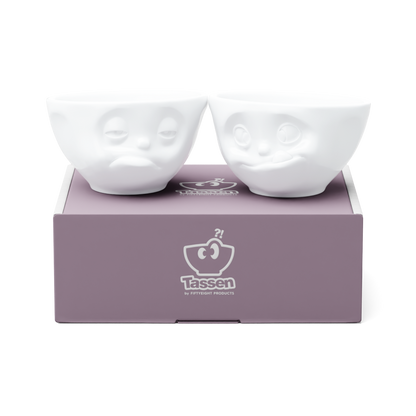 Set of two 6.5 oz. bowls in white from the porcelain product family of fun dishware by FIFTYEIGHT Products. Perfect for serving snacks, nuts, chips, dips, sauces, and a few scoops of ice cream. Dishwasher and microwave safe bowls featuring sculpted ‘tasty’ and 'snoozy' faces. Shipped in exclusively designed gift box.