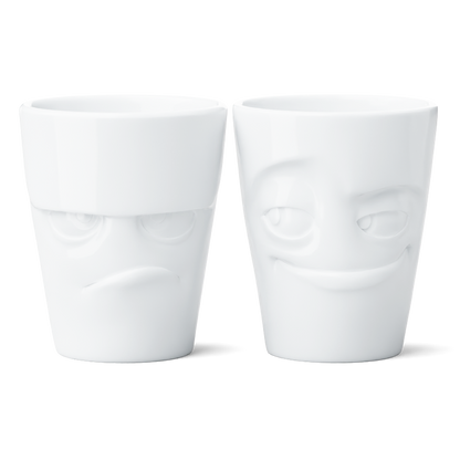 Set of two coffee mugs without handles in white from the porcelain product family of fun dishware by FIFTYEIGHT Products. Each offering 11 oz capacity. Dishwasher and microwave safe coffee cups with 'Grumpy' and 'Impish' facial expression. Shipped in exclusively designed gift box.