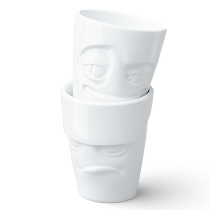 Set of two coffee mugs without handles in white from the porcelain product family of fun dishware by FIFTYEIGHT Products. Each offering 11 oz capacity. Dishwasher and microwave safe coffee cups with 'Grumpy' and 'Impish' facial expression. Shipped in exclusively designed gift box.