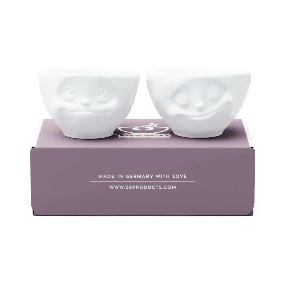 Set of two 3.3 oz. bowls in white from the porcelain product family of fun dishware by FIFTYEIGHT Products. Perfect for serving dips, sauces, nuts, sugar, spices, espresso, jam, honey, and more. Dishwasher and microwave safe bowls featuring 'happy' and 'Dreamy' faces. Shipped in exclusively designed gift box.
