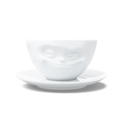 Premium porcelain coffee cup with saucer in white from the porcelain product family of fun dishware by FIFTYEIGHT Products. Offers 6.5 oz capacity and comes with a matching saucer. Dishwasher and microwave safe cup with a 'grinning' facial expression. Shipped in exclusively designed gift box.