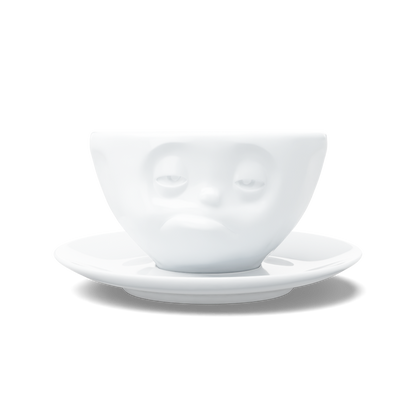 Premium porcelain coffee cup with saucer in white from the porcelain product family of fun dishware by FIFTYEIGHT Products. Offers 6.5 oz capacity and comes with a matching saucer. Dishwasher and microwave safe cup with a ''snoozy' facial expression. Shipped in exclusively designed gift box.