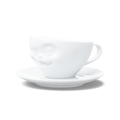 Premium porcelain coffee cup with saucer in white from the porcelain product family of fun dishware by FIFTYEIGHT Products. Offers 6.5 oz capacity and comes with a matching saucer. Dishwasher and microwave safe cup with a 'laughing' facial expression. Shipped in exclusively designed gift box.