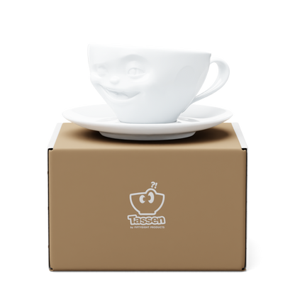 Premium porcelain coffee cup with saucer in white from the porcelain product family of fun dishware by FIFTYEIGHT Products. Offers 6.5 oz capacity and comes with a matching saucer. Dishwasher and microwave safe cup with a 'laughing' facial expression. Shipped in exclusively designed gift box.
