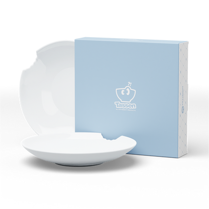 Set of two premium porcelain deep plates in white with a 'bite mark' cutout at the edge. Dishwasher and microwave safes plate with a 9.4 inch diameter. From the porcelain product family of fun dishware by FIFTYEIGHT Products. Made in Germany according to environmental standards.