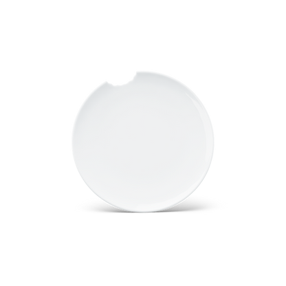 Set of two premium tiny porcelain plates in white with a 'bite mark' cutout at the edge. Dishwasher and microwave safe plate with a 5.9 inch diameter. From the TASSEN product family of fun dishware by FIFTYEIGHT Products. Made in Germany according to environmental standards.