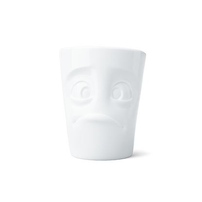 Premium porcelain coffee mug with handle from the porcelain product family of fun dishware by FIFTYEIGHT Products. Offers 11 oz capacity for serving coffee, tea, latte, matcha, soup and more. Dishwasher and microwave safe cup with a 'baffled' facial expression. Shipped in exclusively designed gift box.