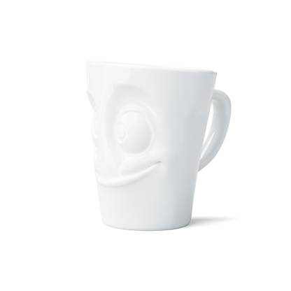 Premium porcelain coffee mug with handle from the porcelain product family of fun dishware by FIFTYEIGHT Products. Offers 11 oz capacity for serving coffee, tea, latte, matcha, soup and more. Dishwasher and microwave safe cup with a 'tasty' facial expression. Shipped in exclusively designed gift box.