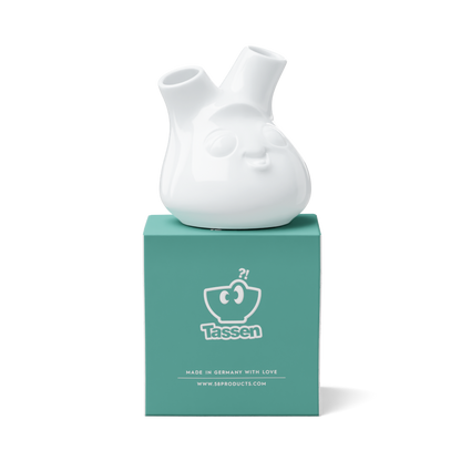 Exclusive designer flower vase made from premium porcelain with a 'cheeky' facial expression. Stands at 3.9 inches tall on a footed base. From the porcelain product family of fun dishware by FIFTYEIGHT Products. Made in Germany according to environmental standards.