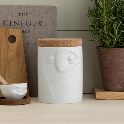 Quality porcelain storage jar with 57 oz. capacity and a 'charming' facial expression. Closes securely with a natural cork lid. Dishwasher and microwave-safe (except for cork lid).From the porcelain product family of fun dishware by FIFTYEIGHT Products. Made in Germany according to environmental standards.standards.