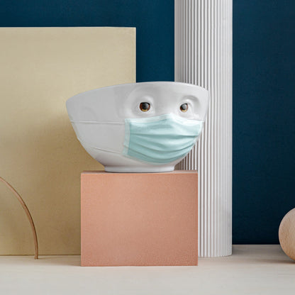 Premium porcelain bowl with colorful accents from porcelain product family of fun dishware by FIFTYEIGHT Products. Offers 16 oz capacity perfect for serving cereal, soup, snacks and much more. Dishwasher and microwave safe bowl featuring a ‘hopeful’ facial expression and colorful eyes and blue mask. Shipped in gift box.