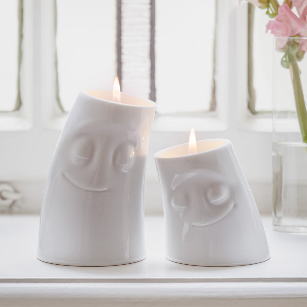 Exclusive designer candle holder with COZY facial expression. Stands at 3.3 inches tall on a footed base and fits a tea light or LED light. From the TASSEN product family of fun dishware by FIFTYEIGHT Products. Made in Germany according to environmental standards.