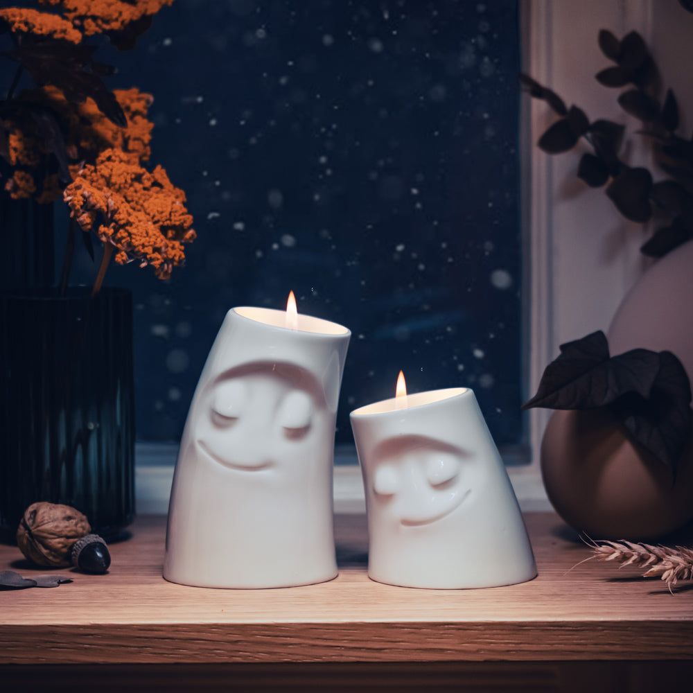 Exclusive designer candle holder with COZY facial expression. Stands at 3.3 inches tall on a footed base and fits a tea light or LED light. From the TASSEN product family of fun dishware by FIFTYEIGHT Products. Made in Germany according to environmental standards.