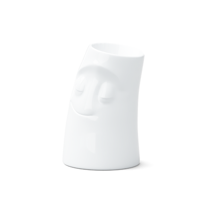 Exclusive designer candle holder with CUDDLY facial expression. Stands at 4.4 inches tall on a footed base and fits a tea light or LED light. From the TASSEN product family of fun dishware by FIFTYEIGHT Products. Made in Germany according to environmental standards.