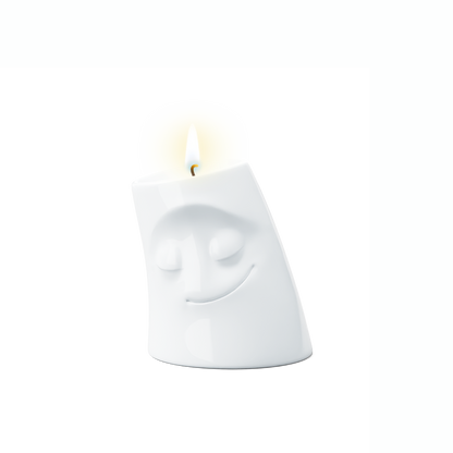 Exclusive designer candle holder with COZY facial expression. Stands at 3.3 inches tall on a footed base and fits a tea light or LED light. From the TASSEN product family of fun dishware by FIFTYEIGHT Products. Made in Germany according to environmental standards.