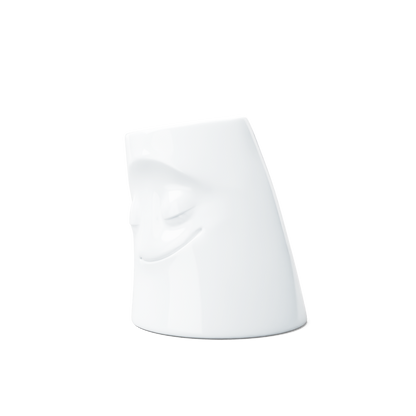 Exclusive designer candle holder with COZY facial expression. Stands at 3.3 inches tall on a footed base and fits a tea light or LED light. From the TASSEN product family of fun dishware by FIFTYEIGHT Products. Made in Germany according to environmental standards.