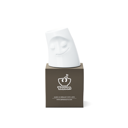 Exclusive designer candle holder with COZY facial expression. Stands at 3.3 inches tall on a footed base and fits a tea light or LED light. From the TASSEN product family of fun dishware by FIFTYEIGHT Products. Made in Germany according to environmental standards.