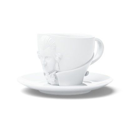 Premium porcelain coffee cup with saucer in white with sculpted Wolfgang Amadeus Mozart face. Dishwasher and microwave safe cup at 8.7 oz capacity. From the TALENT product family of cups dedicated to creative geniuses by FIFTYEIGHT Products. Made in Germany according to environmental standards.